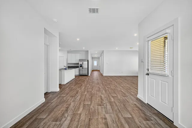 a view of kitchen and wooden floor