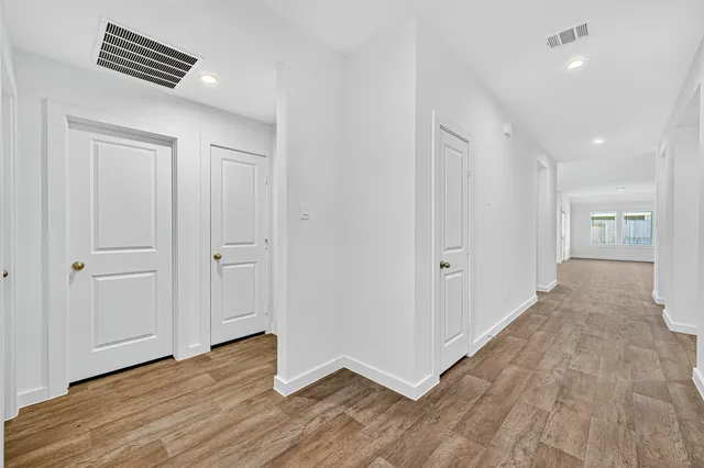 a view of an empty room and glass door