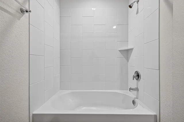 a close view of a bathtub in bathroom