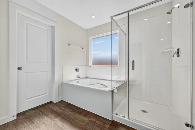 a bathroom with a shower and a sink
