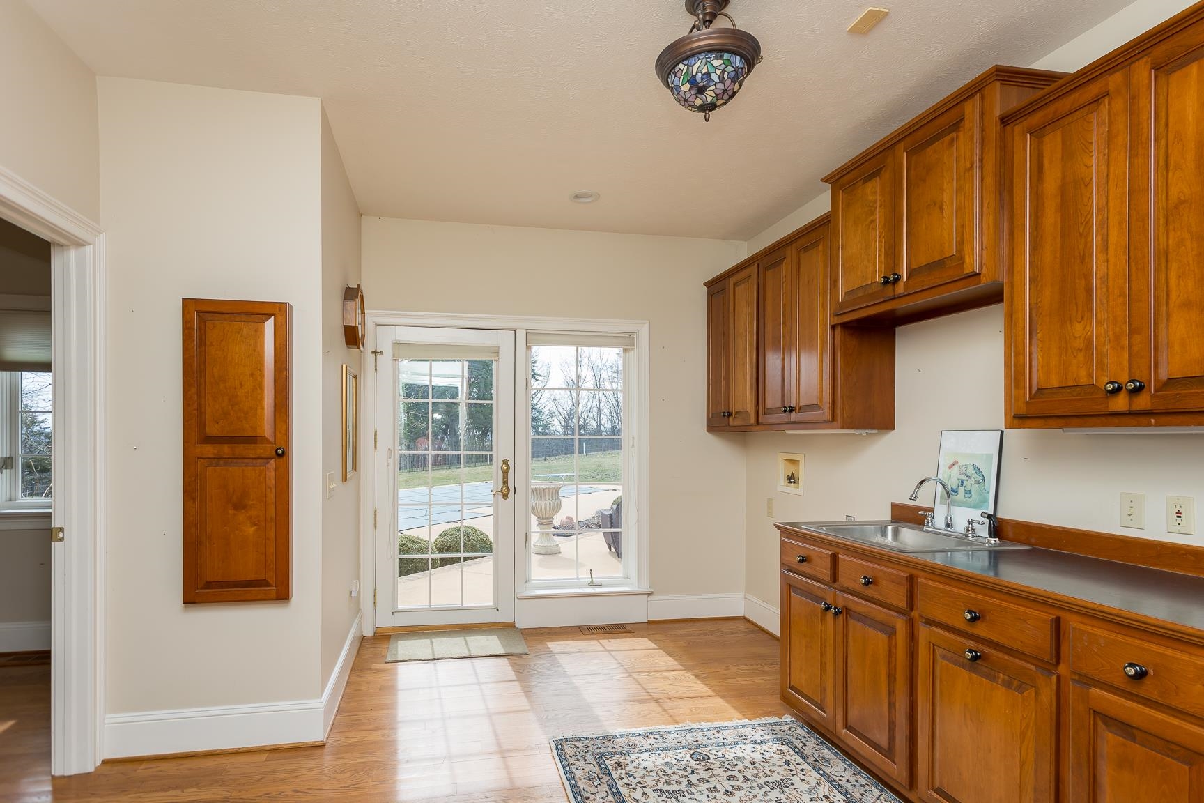 1582 North River Road Mount Crawford, VA 22841 - Photo 48 of 75 a kitchen with granite countertop wooden cabinets a sink a window and stainless steel appliances