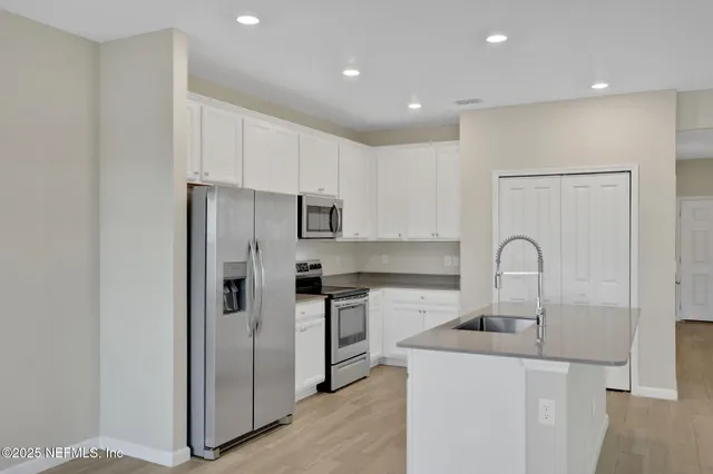an empty room with a ceiling fan and a fan
