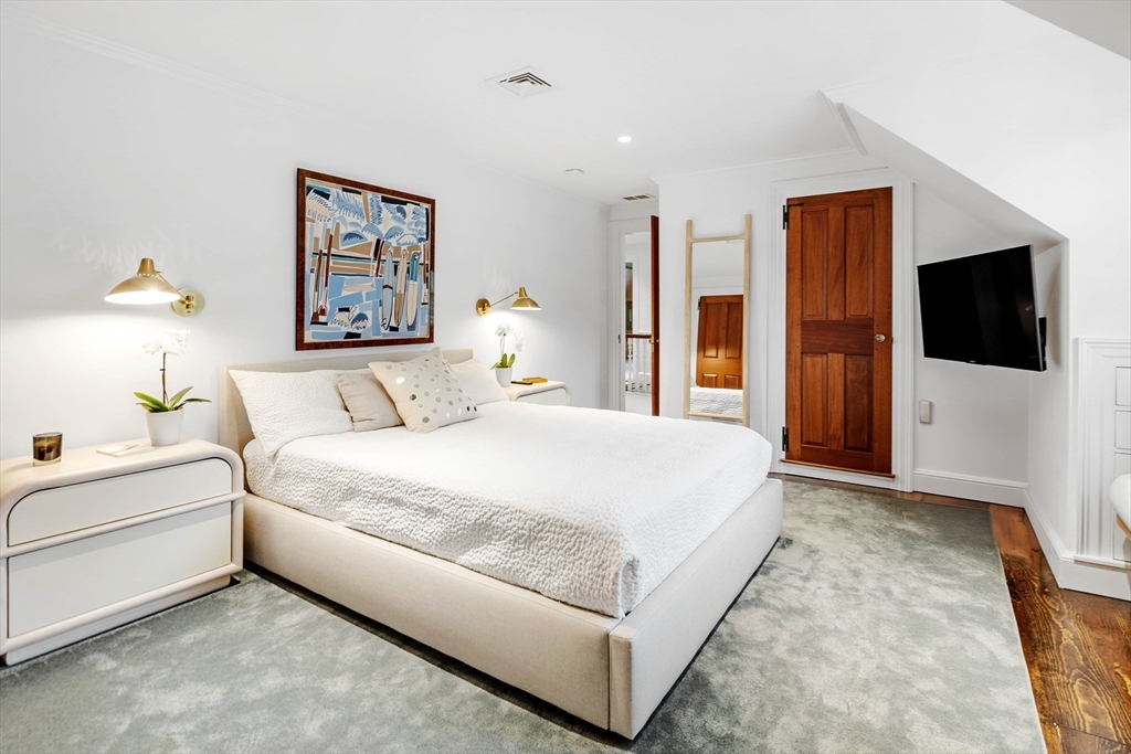 17 Cole Road Hingham, MA 02043 - Photo 15 of 29 a bedroom with a bed and a flat screen tv