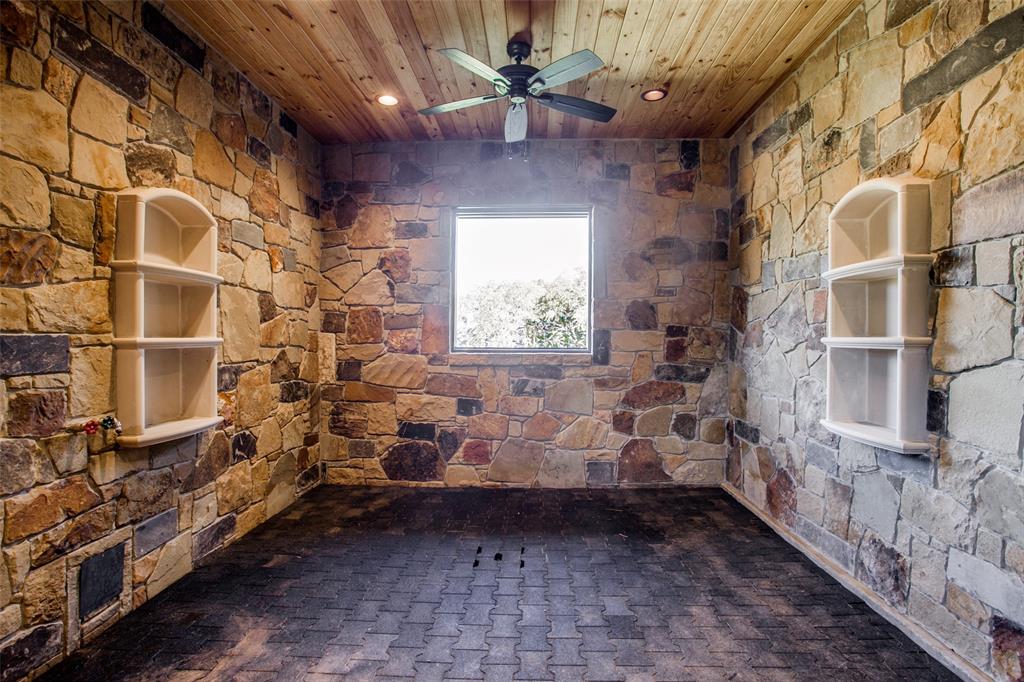 12630 Merrill Road Pilot Point, TX 76258 - Photo 30 of 39 Beautiful stone wash rack, rubber pavers and built in stone shelves for grooming supplies.