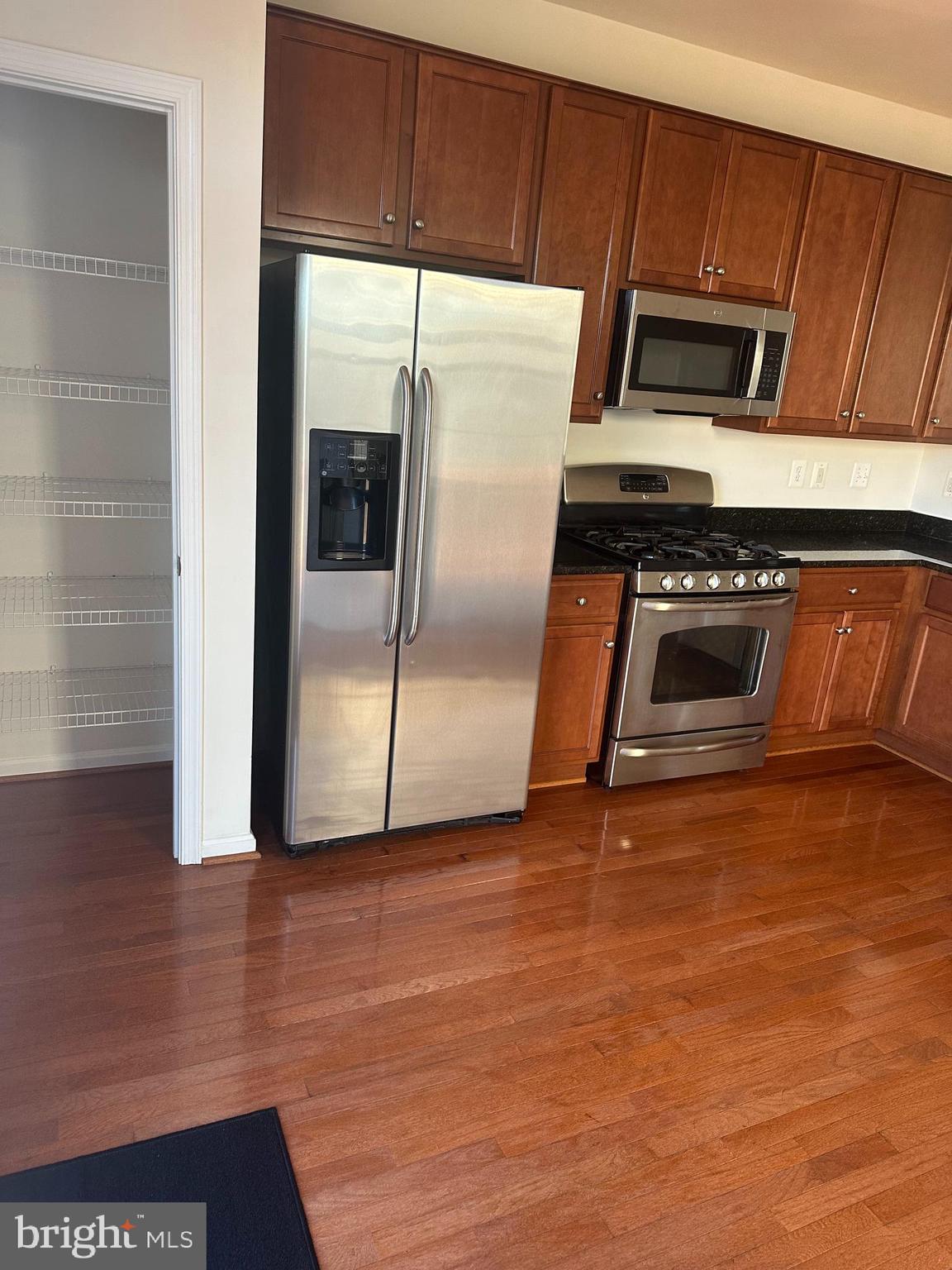 15715 John Diskin Circle Woodbridge, VA 22191 - Photo 11 of 21 a metallic refrigerator freezer sitting in a kitchen