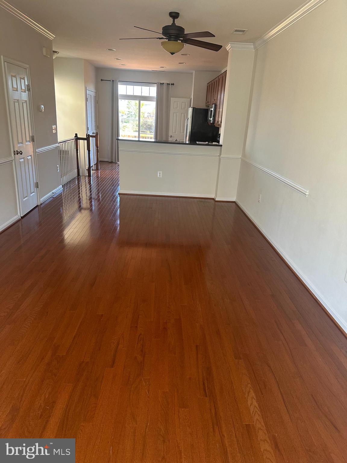 15715 John Diskin Circle Woodbridge, VA 22191 - Photo 13 of 21 a view of empty room with wooden floor and fan
