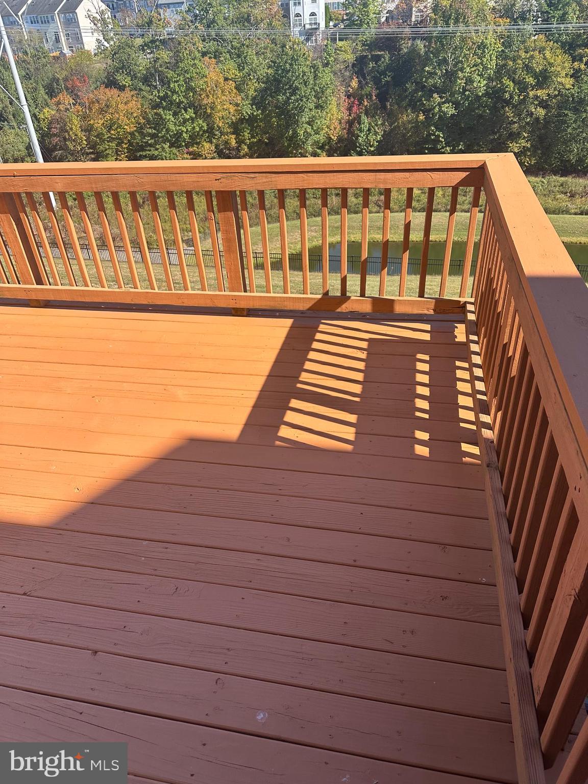 15715 John Diskin Circle Woodbridge, VA 22191 - Photo 17 of 21 a view of a wooden deck and trees