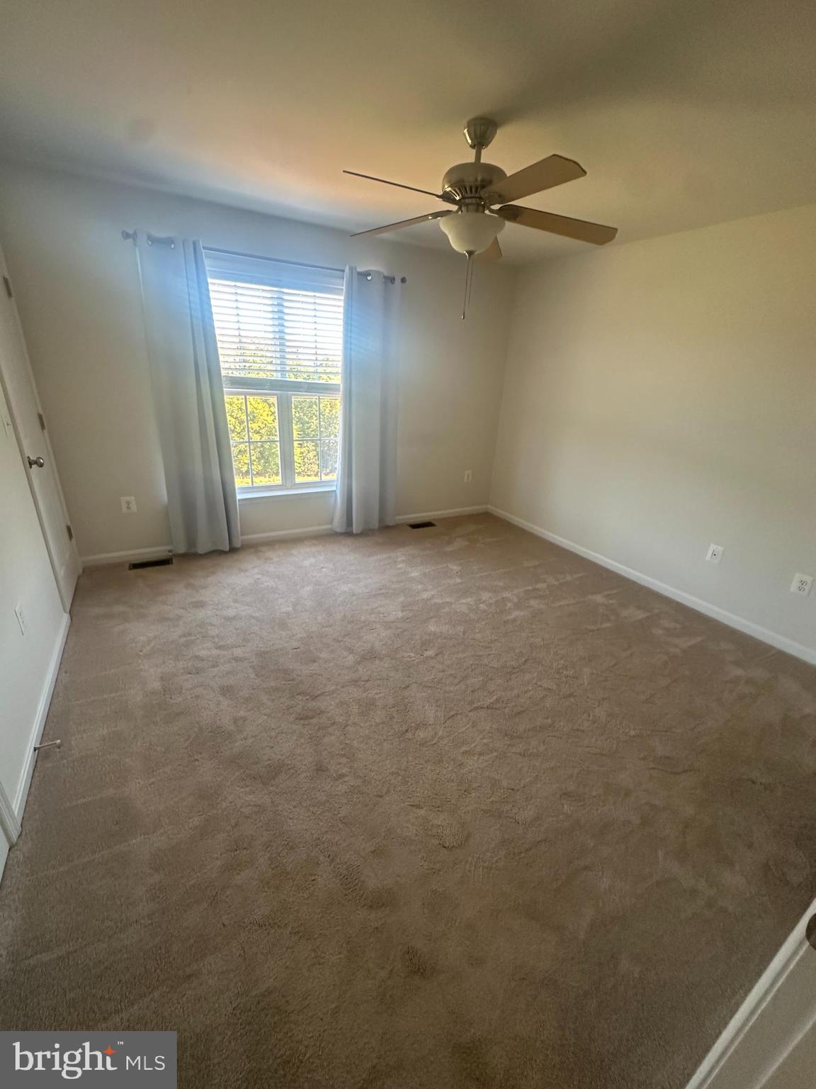 15715 John Diskin Circle Woodbridge, VA 22191 - Photo 6 of 21 wooden floor in an empty room with a window