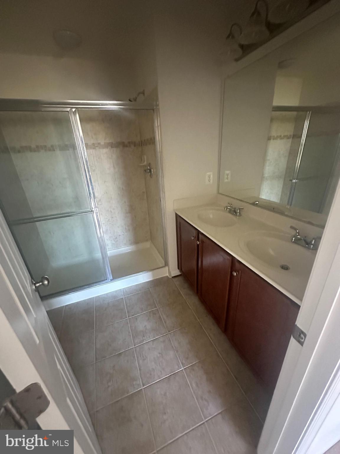 15715 John Diskin Circle Woodbridge, VA 22191 - Photo 7 of 21 a bathroom with a granite countertop sink a toilet and shower