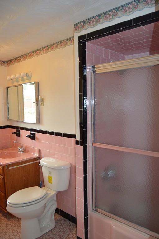 59 Joseph Road Framingham, MA 01701 - Photo 14 of 30 a bathroom with a toilet a sink and mirror