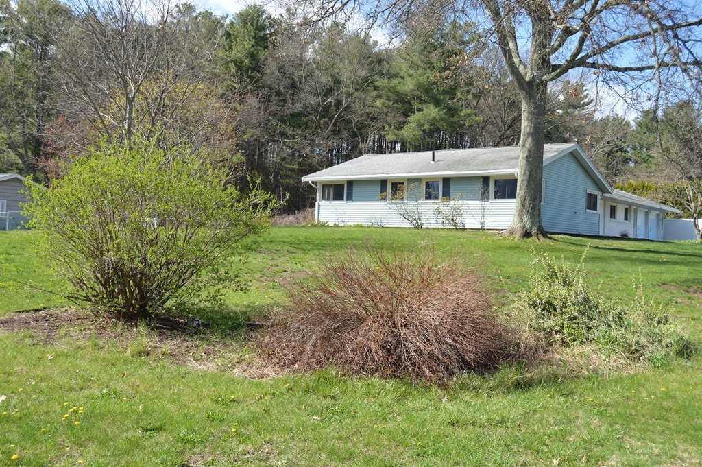 59 Joseph Road Framingham, MA 01701 - Photo 2 of 30 a view of a house with a yard and a large tree