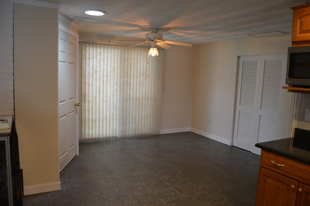 59 Joseph Road Framingham, MA 01701 - Photo 7 of 30 an empty room with windows and cabinet