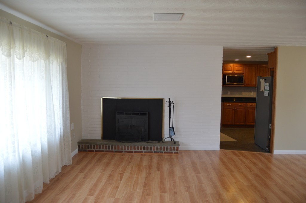 59 Joseph Road Framingham, MA 01701 - Photo 9 of 30 a view of empty room with wooden floor