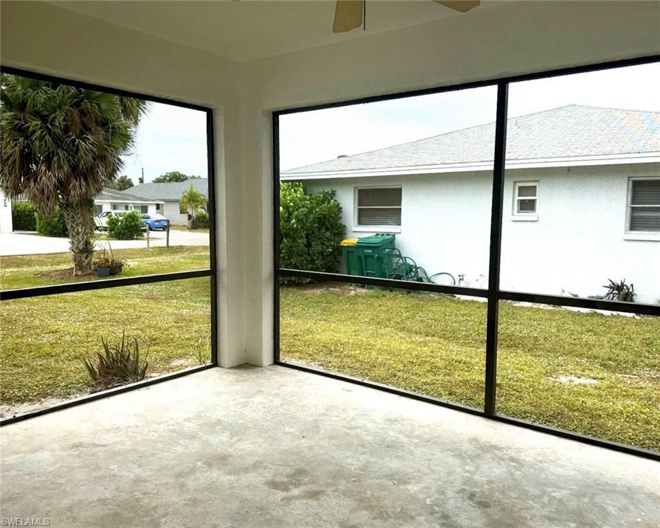699 110th Avenue North, Unit A Naples, FL 34108 - Photo 5 of 15 a view of a large window with an outdoor space