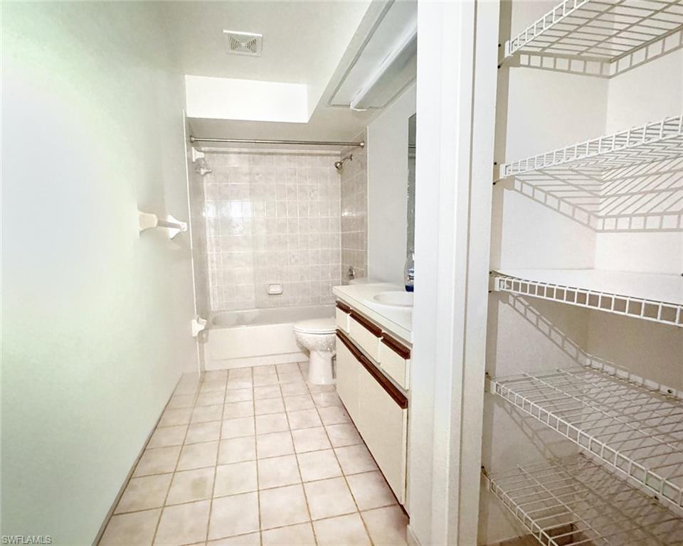 699 110th Avenue North, Unit A Naples, FL 34108 - Photo 9 of 15 a bathroom with a bathtub and a shower