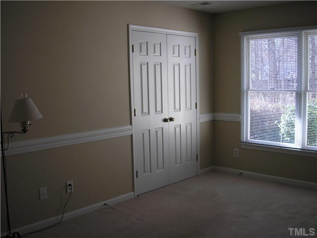 2654 Cottage Circle Raleigh, NC 27613 - Photo 17 of 17 an empty room with windows