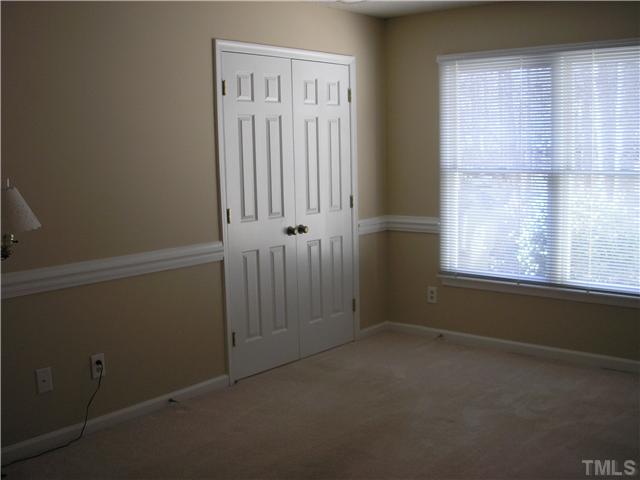 2654 Cottage Circle Raleigh, NC 27613 - Photo 9 of 17 an empty room with windows