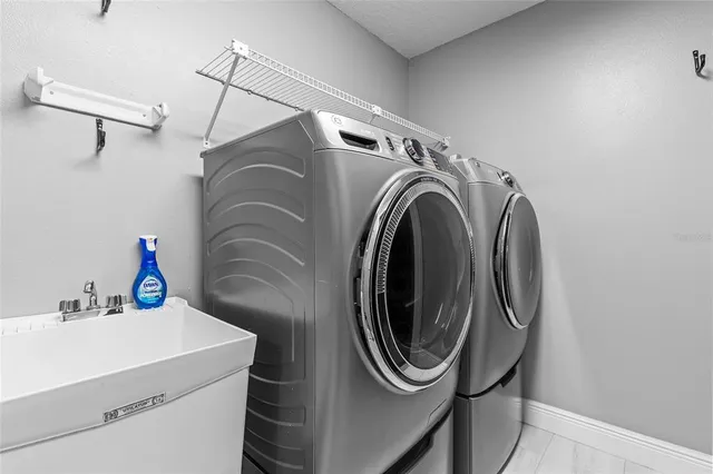 a utility room with dryer and washer
