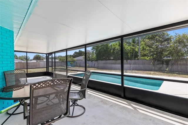 a view of a chairs and table in patio