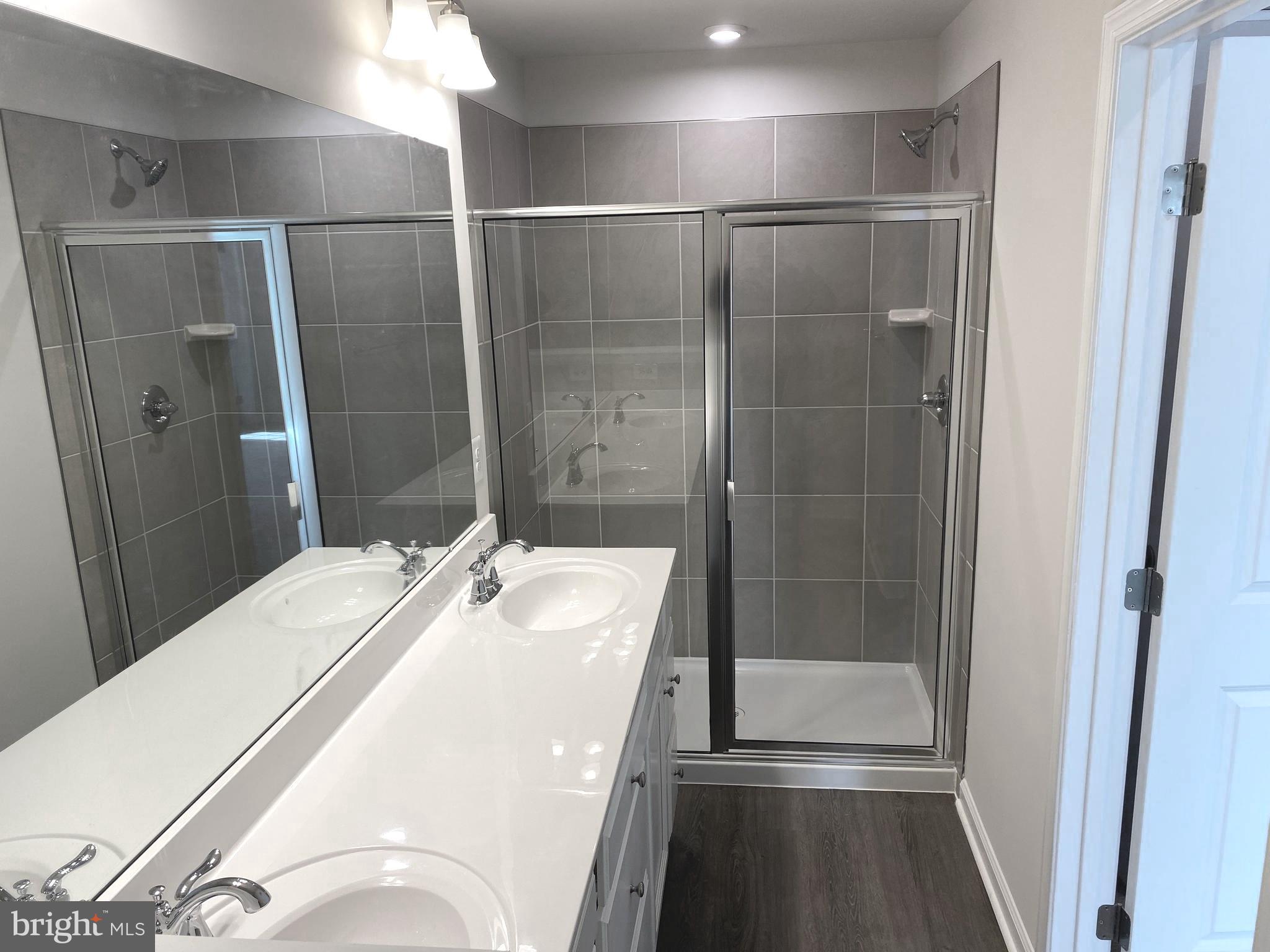 7911 Independence Drive, Unit 1C Spotsylvania, VA 22553 - Photo 14 of 35 a bathroom with a shower and a sink