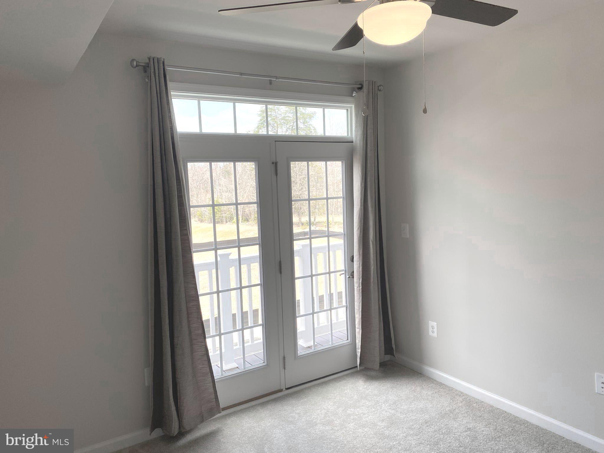 7911 Independence Drive, Unit 1C Spotsylvania, VA 22553 - Photo 22 of 35 an empty room with windows