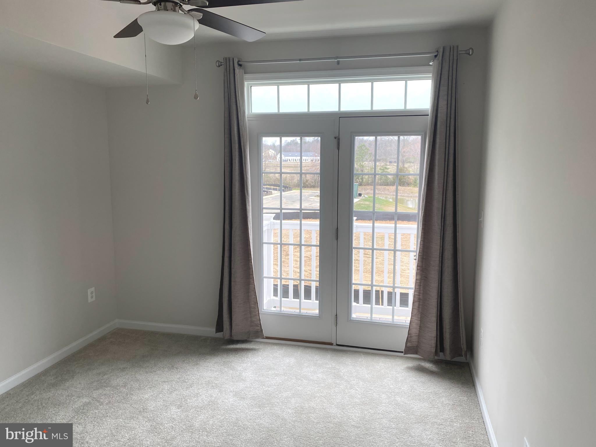7911 Independence Drive, Unit 1C Spotsylvania, VA 22553 - Photo 23 of 35 a view of an empty room with a window