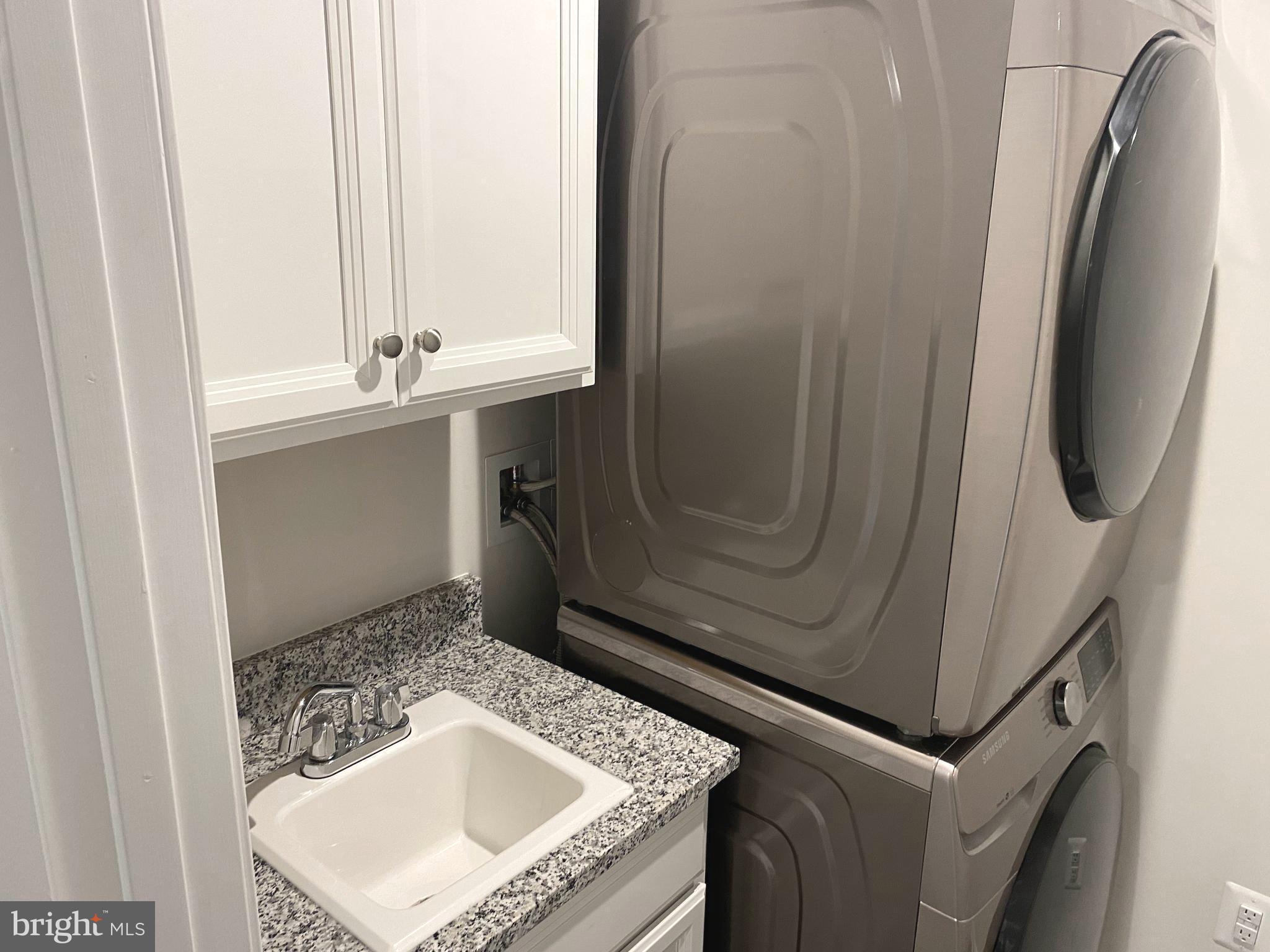 7911 Independence Drive, Unit 1C Spotsylvania, VA 22553 - Photo 30 of 35 a bathroom with a sink a mirror and vanity