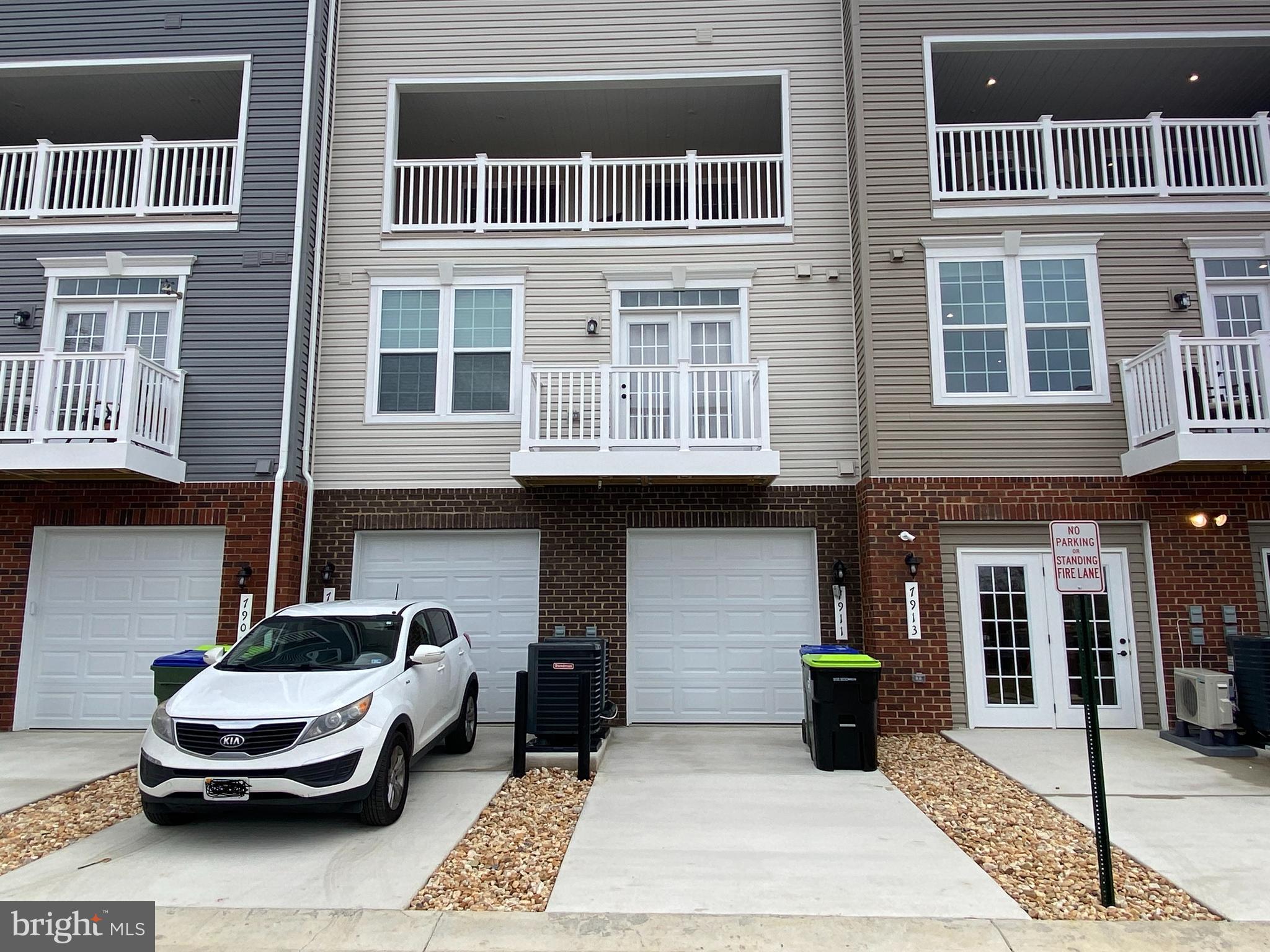 7911 Independence Drive, Unit 1C Spotsylvania, VA 22553 - Photo 34 of 35 a car parked in front of a building