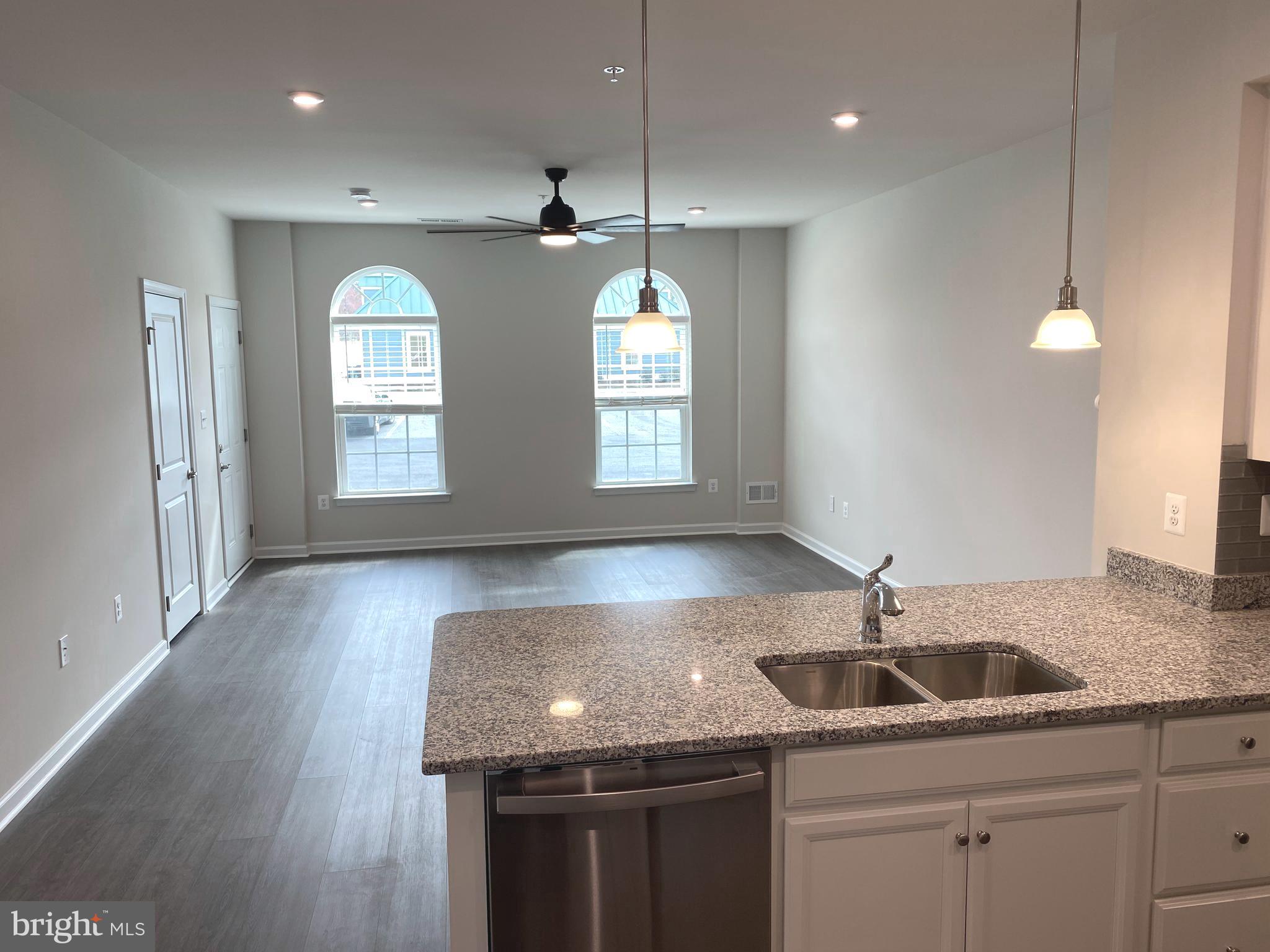 7911 Independence Drive, Unit 1C Spotsylvania, VA 22553 - Photo 6 of 35 a kitchen with a sink window and cabinets