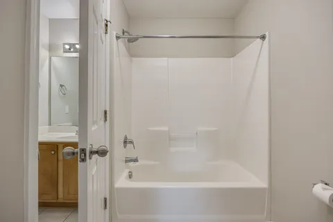 a view of a house with wooden fence