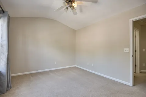 a view of a patio with chairs and a table