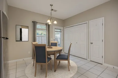 a kitchen with a stove a refrigerator and cabinets