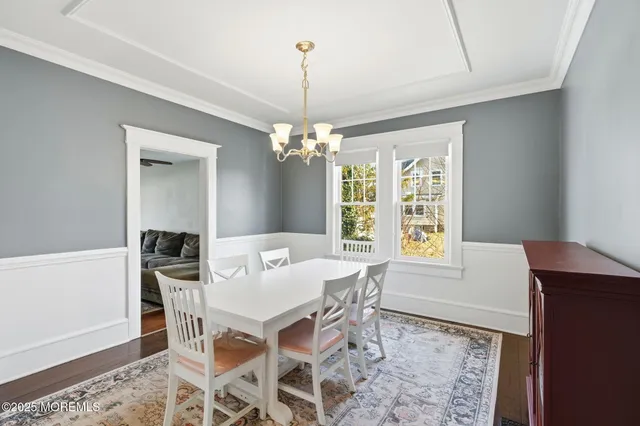 a view of a dining room with furniture and window