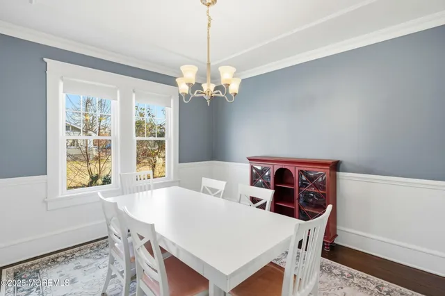 a view of a dining room with furniture and window