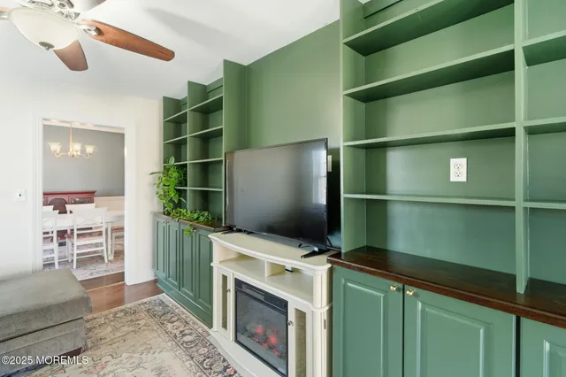 a kitchen with a refrigerator and a sink