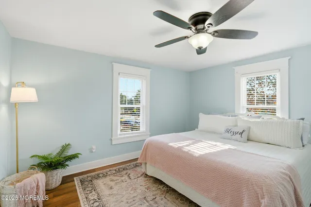 a bedroom with a balcony a bed and a window