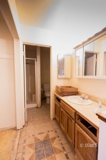 1653 South Fire Opal Street Ridgecrest, CA 93555 - Photo 15 of 28 a view of a kitchen with a sink and a refrigerator