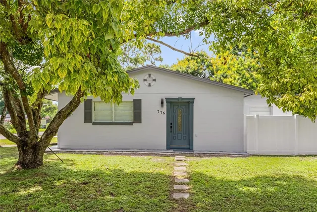 a house with a tree in front of it