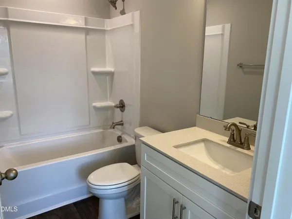 a bathroom with a sink toilet and bathtub