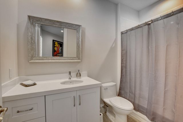 a view of living room with furniture and lamp