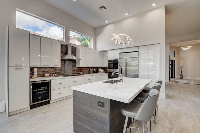 a swimming pool with outdoor seating and yard