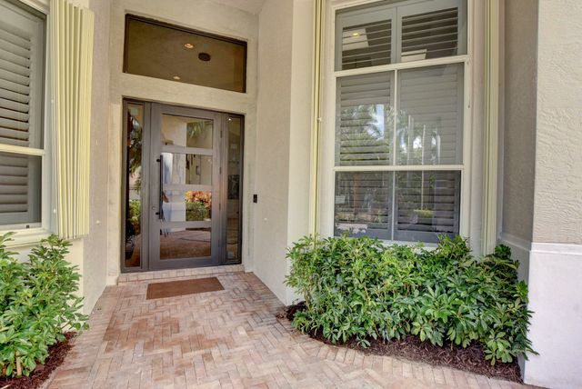 a bathroom with a toilet a sink and a mirror