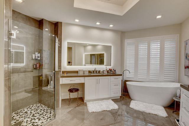 a bathroom with a bathtub and a shower