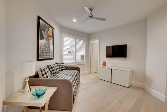 a view of a dining room with furniture and a window