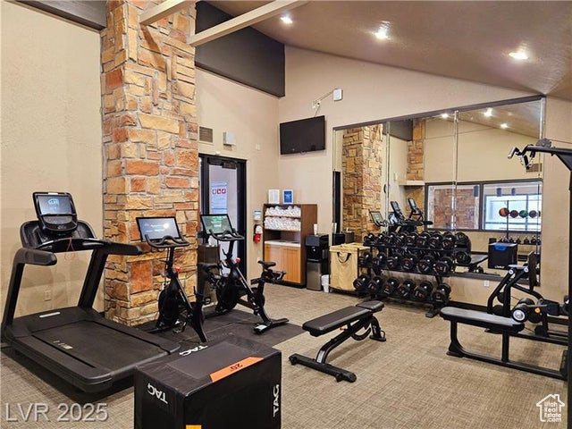 223 Hunter Ridge Drive, Unit E121 Brian Head, UT 84719 - Photo 20 of 35 Gym with carpet floors, high vaulted ceiling, and recessed lighting