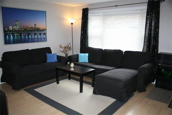 8 Apple Ridge Road, Unit 6 Maynard, MA 01754 - Photo 1 of 30 a living room with furniture and a window