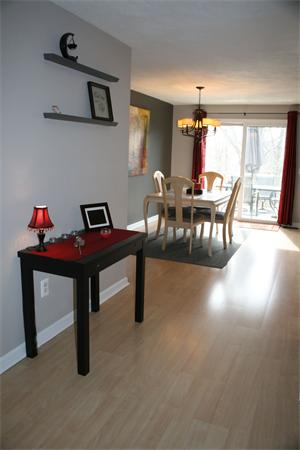 8 Apple Ridge Road, Unit 6 Maynard, MA 01754 - Photo 3 of 30 a living room with furniture and a window