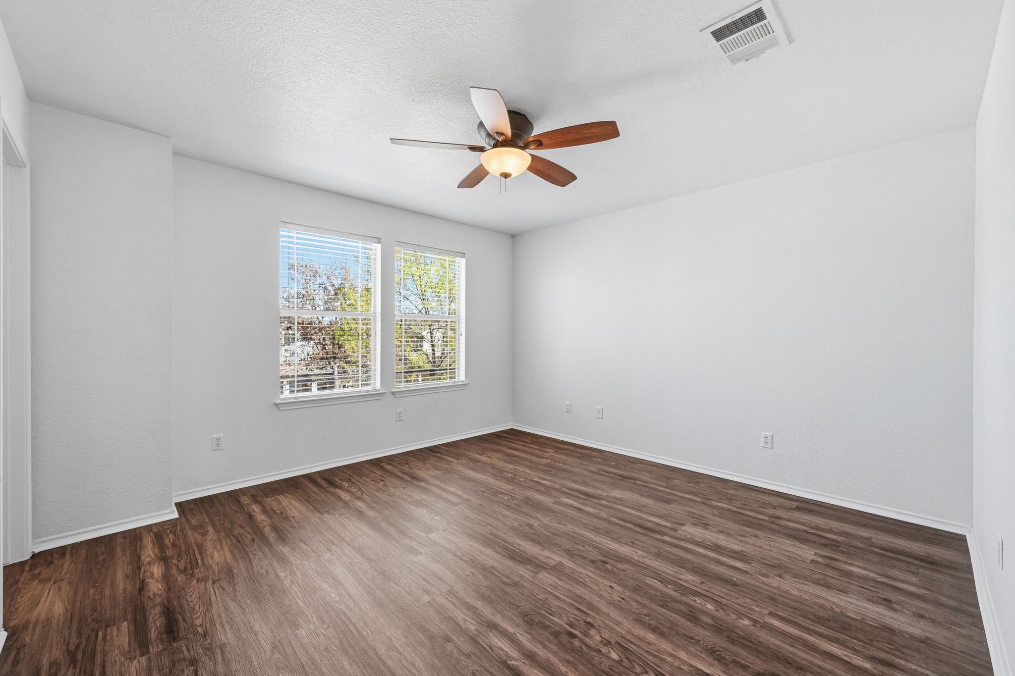 1805 Lost Maples Loop Cedar Park, TX 78613 - Photo 12 of 31 an empty room with windows and fan