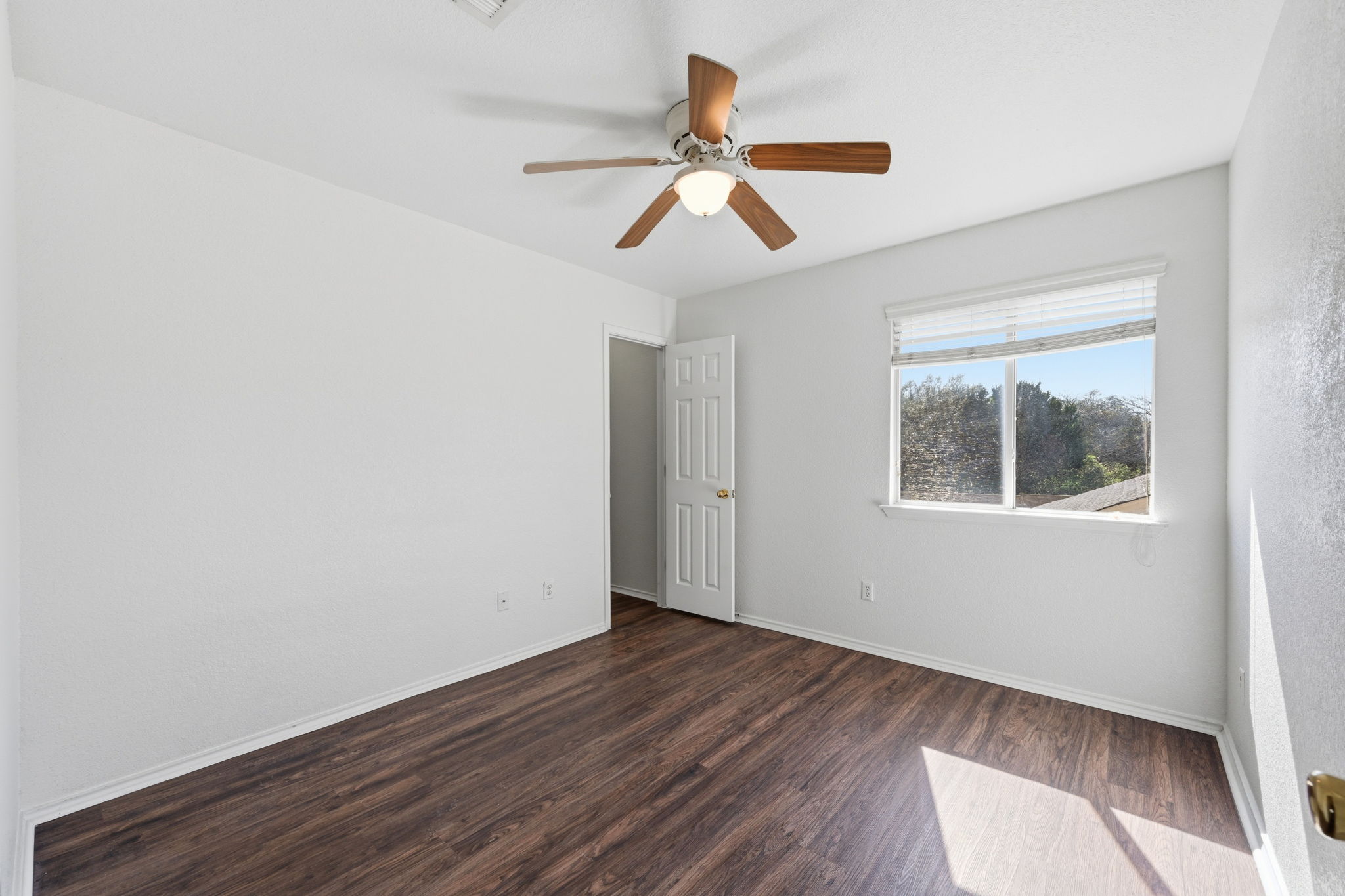 1805 Lost Maples Loop Cedar Park, TX 78613 - Photo 17 of 31 a view of empty room with wooden floor and fan