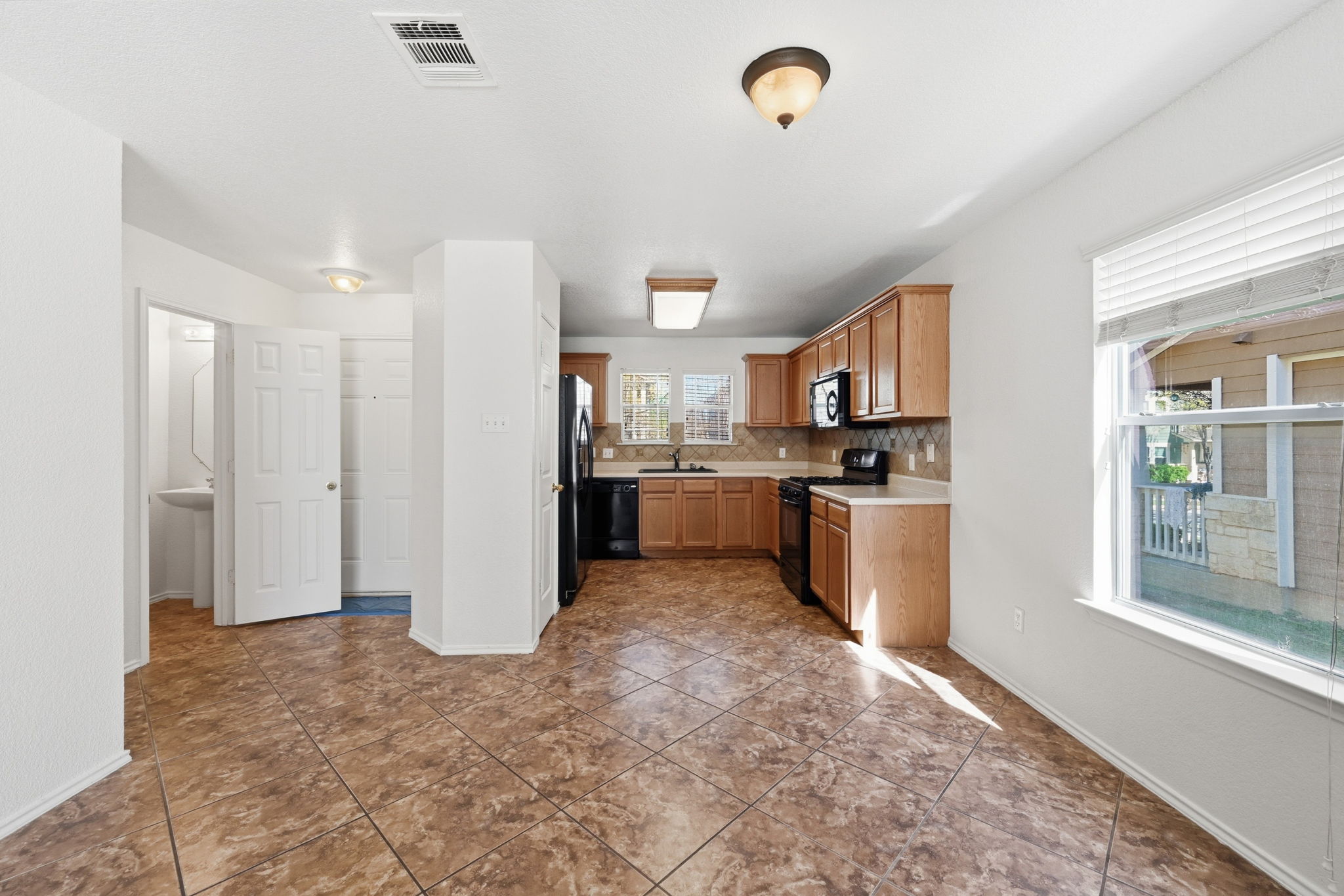 1805 Lost Maples Loop Cedar Park, TX 78613 - Photo 10 of 31 a view of kitchen with stainless steel appliances granite countertop a refrigerator and a sink